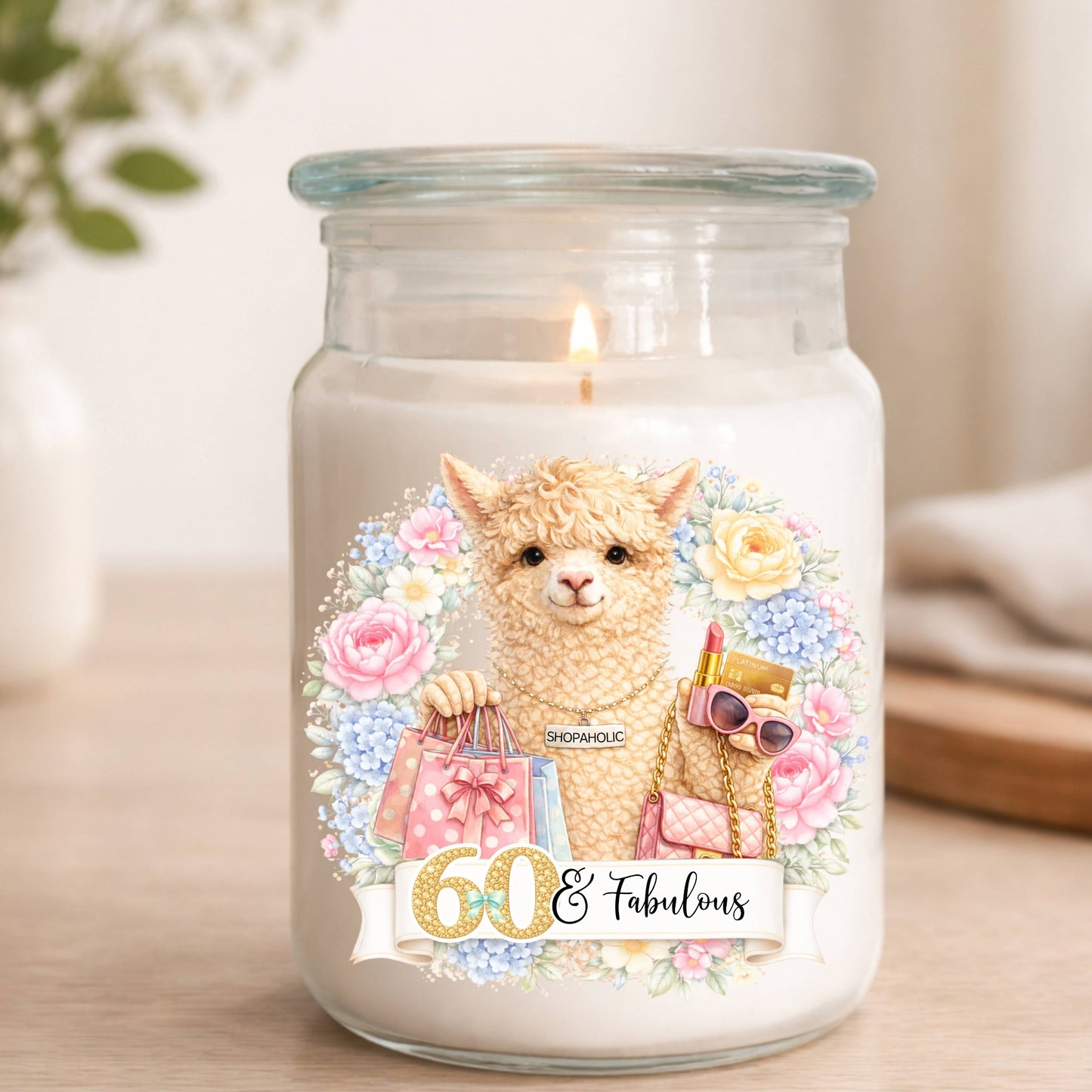 Candle in a jar with an alpaca design and '60 & Fabulous' text on a neutral background.
