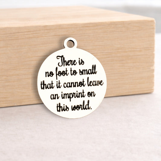 Round white pendant with black text on a wooden block