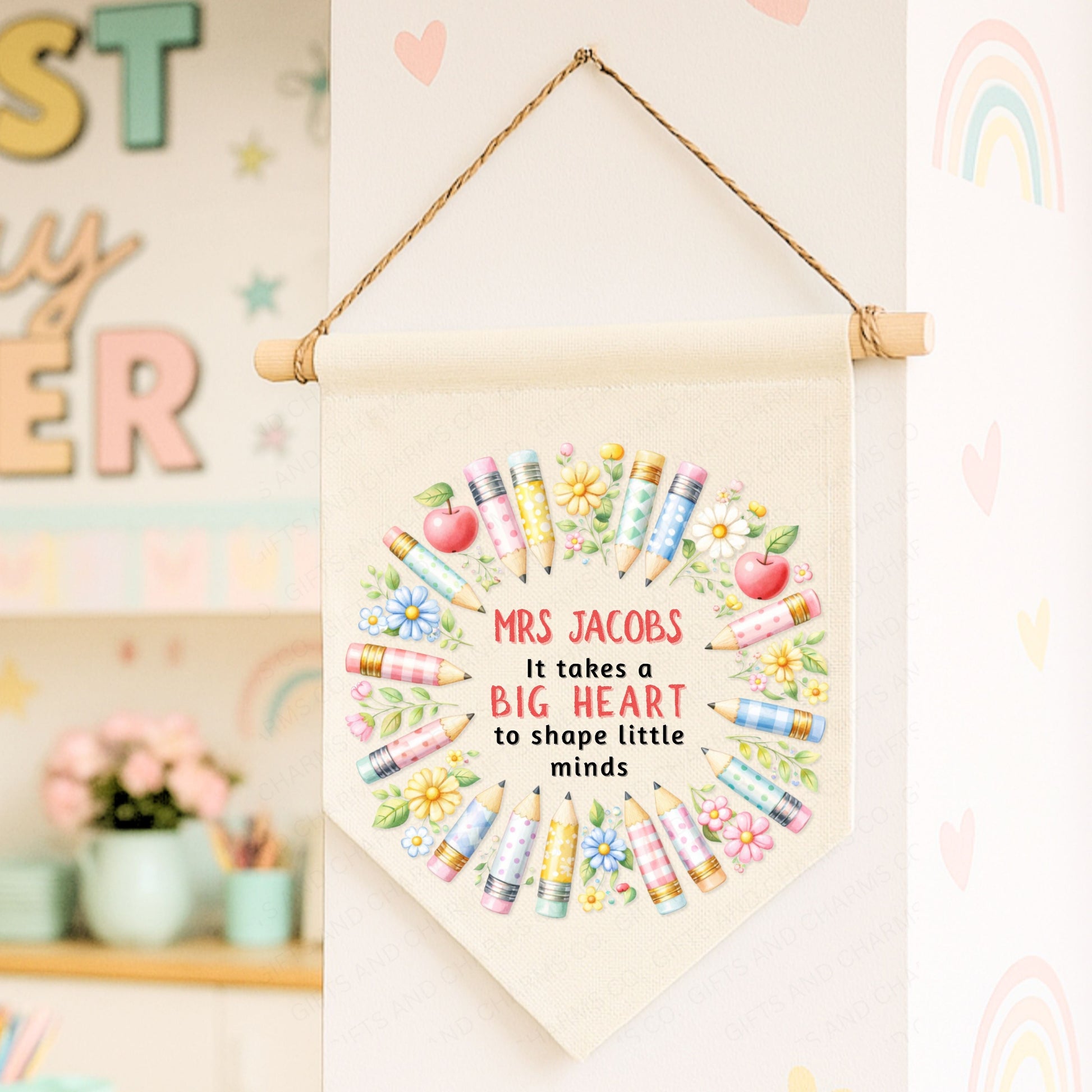 Decorative banner with colorful crayons and text on a wall with educational decor.