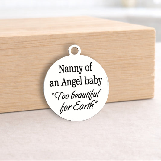Round white pendant with engraved text on a wooden block