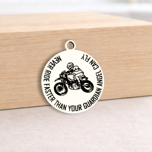Round pendant with motorcycle design and text on a wooden block