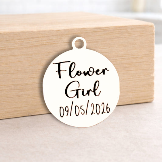 Round 'Flower Girl' tag with date on a wooden block