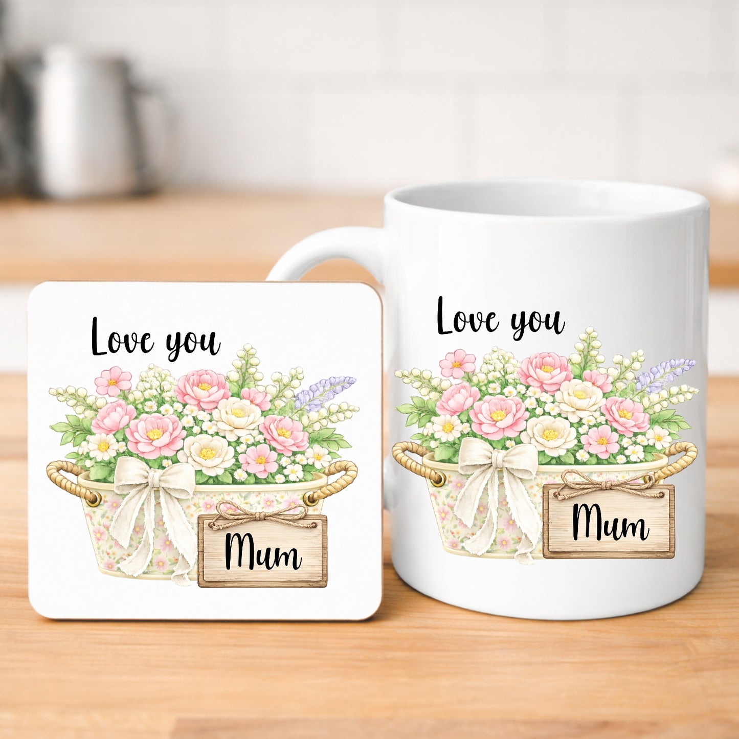 Mug and coaster set with floral design and 'Love you Mum' text on a wooden surface.