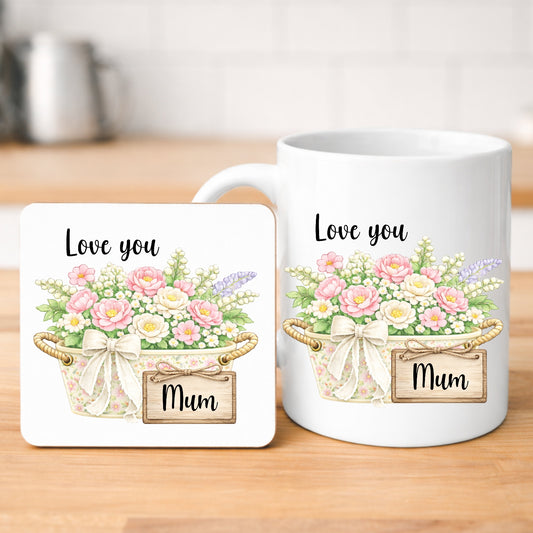 Mug and coaster set with floral design and 'Love you Mum' text on a wooden surface.