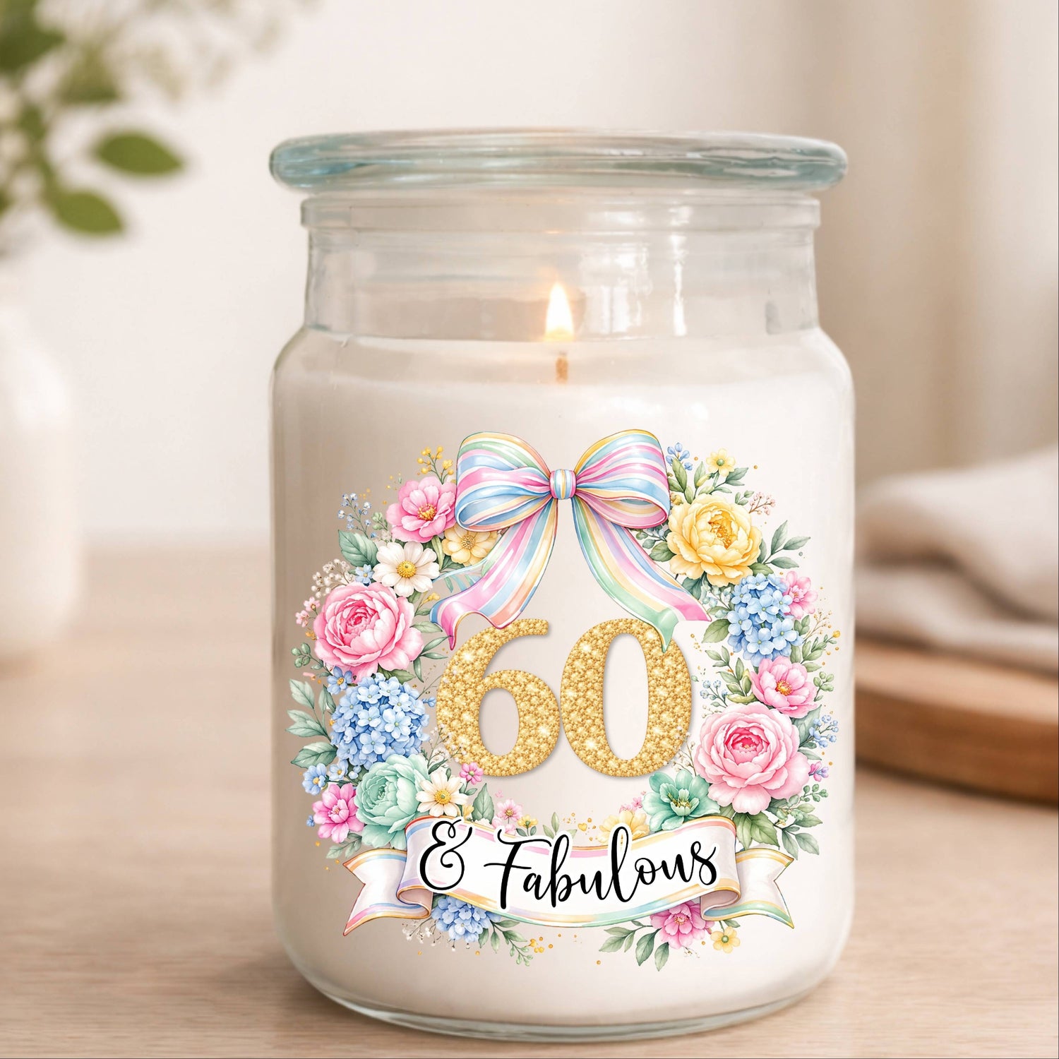 Candle in a jar with a decorative label reading '60 & Fabulous' on a wooden surface.