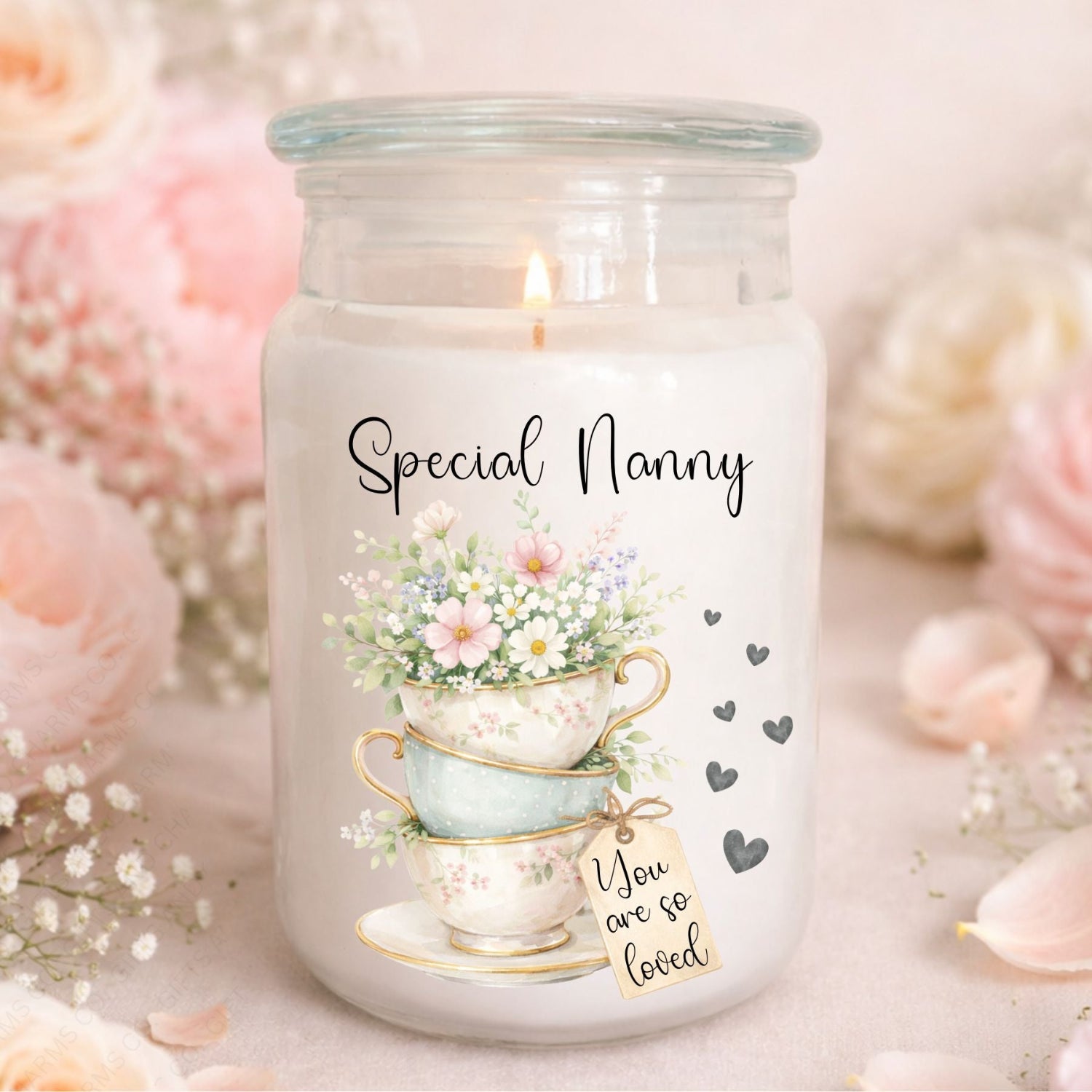 Candle jar with floral design and text 'Special Nanny You are so loved' on a soft background